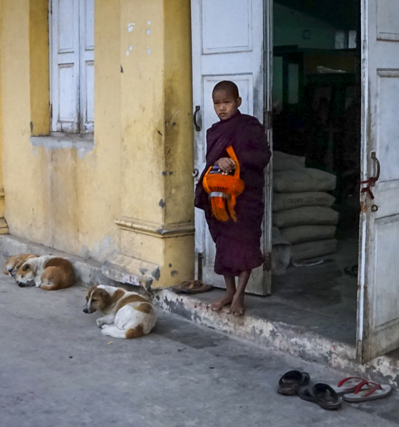 61- Monk with Offering Basket by Door
