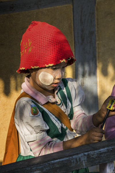 92- Boy In Red Hat and Traditional Thanaka Sunscreen
