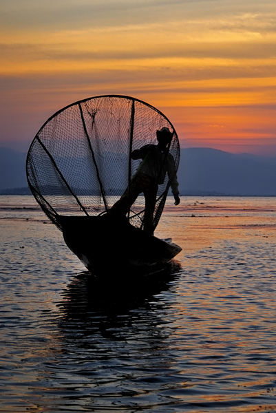 46- Fisherman Framed By Net